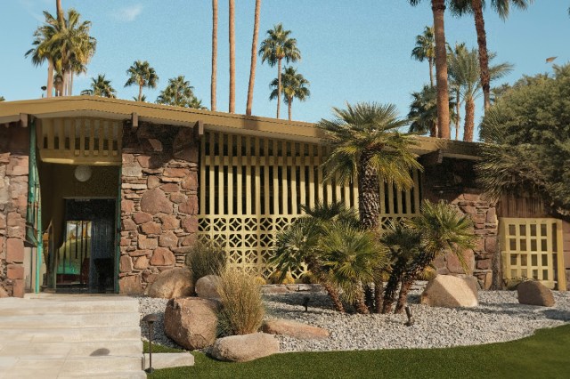 Palm trees near the front of a house