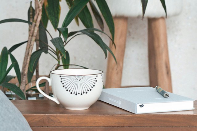 A mug with a journal 