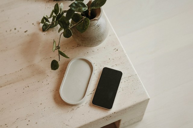 A cell phone sitting on top of a marble table