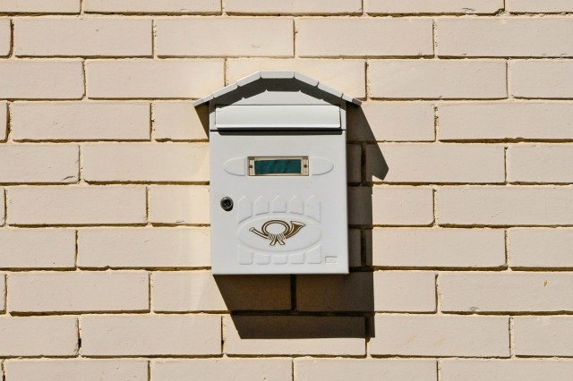 A mailbox hanging on a wall