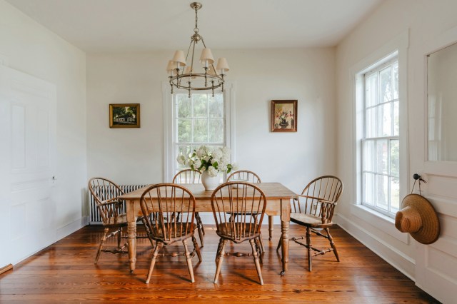 A wooden dining room table and chairs