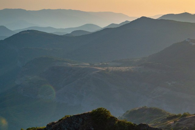 A view of a mountain range covered in trees