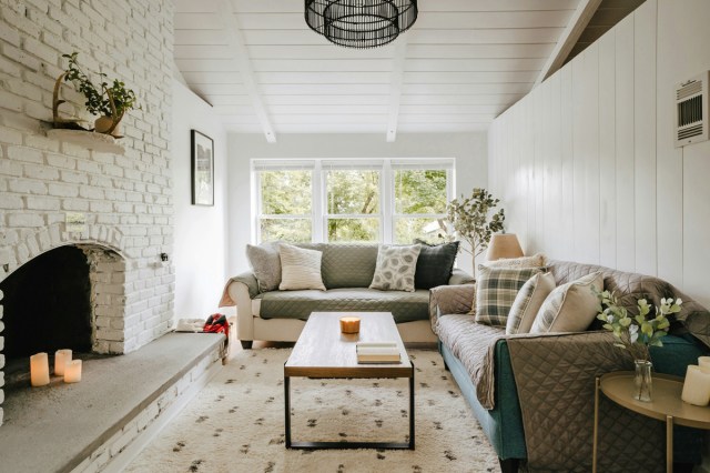 A living room filled with furniture and a fireplace 