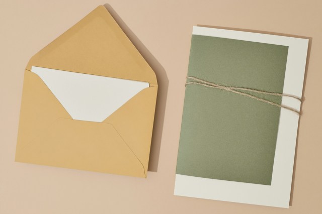 An envelope with a letter next to it 