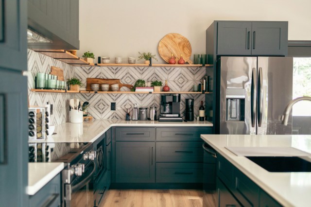 A kitchen with blue cabinets