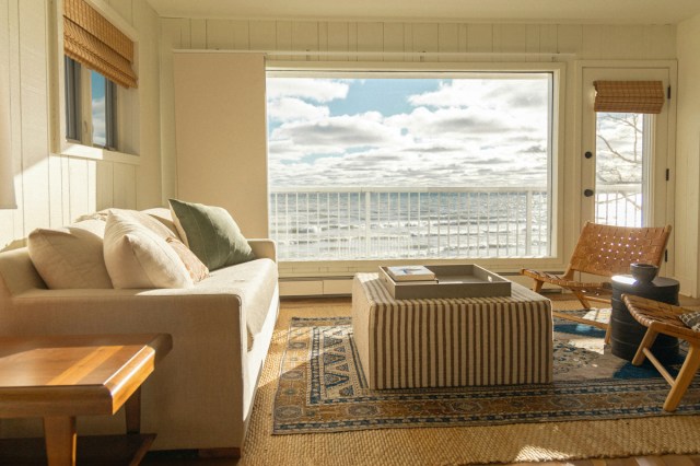 A living room with a view of the sea